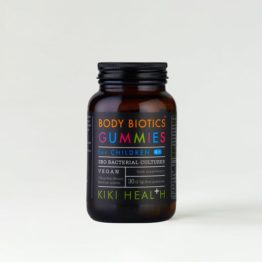 A dark jar labelled Body Biotics Gummies with colourful text.
