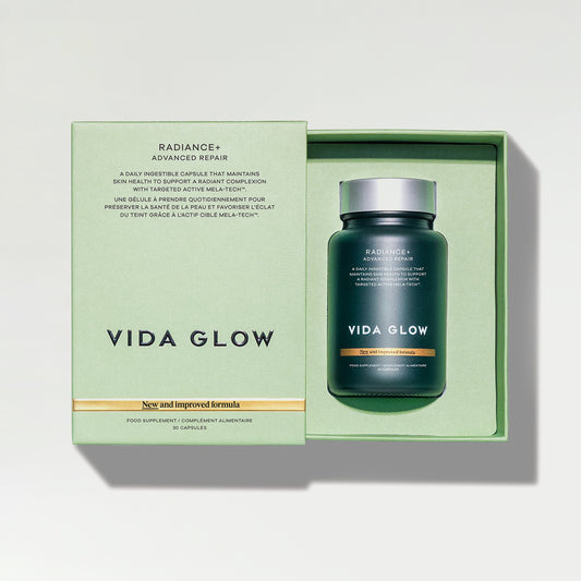 A green box with a jar of Vida Glow supplements inside.