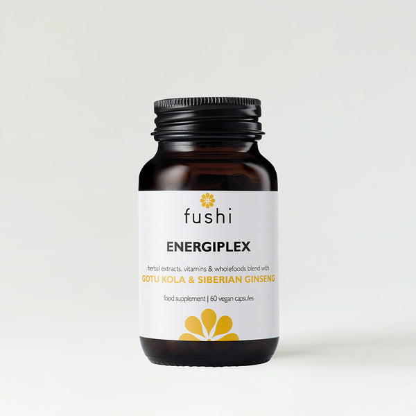 A bottle of Fushi Energiplex supplement with a black cap.